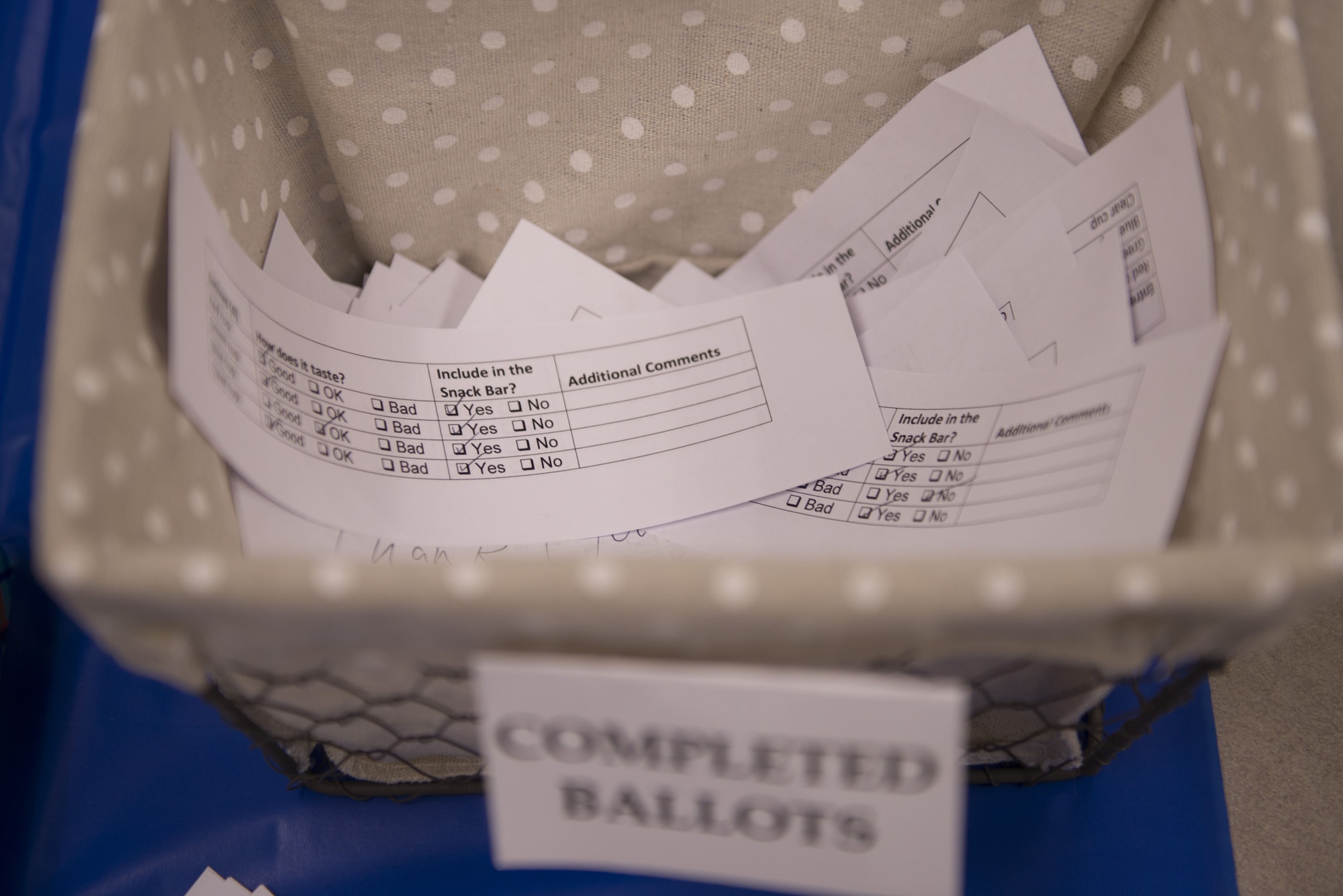 Ballots voting for the implementation of various food samples from a taste test at the 62nd Aircraft Maintenance Unit sit in the ballot box Jan. 18, 2018, at Luke Air Force Base. The taste test was part of an initiative led by Deb Robinson, the base dietician, to change unit snackbars to be healthier.