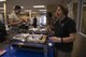 Deb Robinson, 56th Medical Group dietician, serves healthy entree samples as part of a taste test to members of the 62nd Aircraft Maintenance Unit Jan. 18, 2018, at Luke Air Force Base. Robinson, also known as 