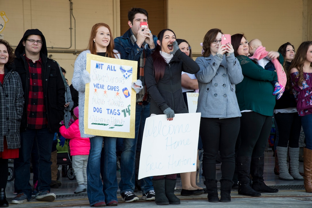 Family members await the arrival of the 74th Fighter Squadron during a redeployment ceremony, Jan. 19, 2018, at Moody Air Force Base, Ga. Over 300 Airmen from Team Moody deployed for seven months in support of Operation Inherent Resolve to defeat ISIS in designated areas in Iraq and Syria. (U.S. Air Force photo by Andrea Jenkins)