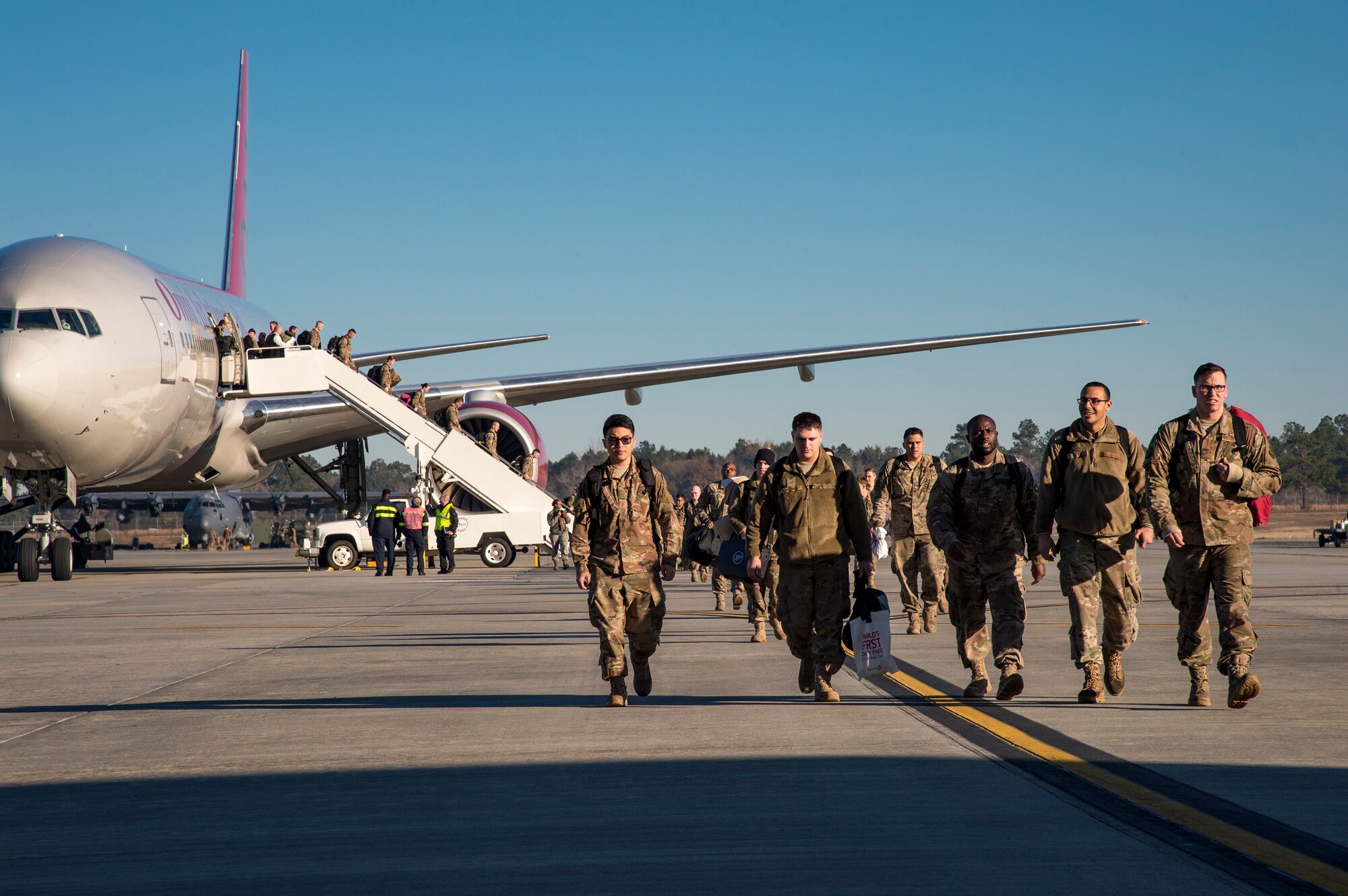 Airmen from the 74th Fighter Squadron exit the plane during a redeployment ceremony, Jan. 19, 2018, at Moody Air Force Base, Ga. Over 300 Airmen from Team Moody deployed for seven months in support of Operation Inherent Resolve to defeat ISIS in designated areas in Iraq and Syria. (U.S. Air Force photo by Andrea Jenkins)