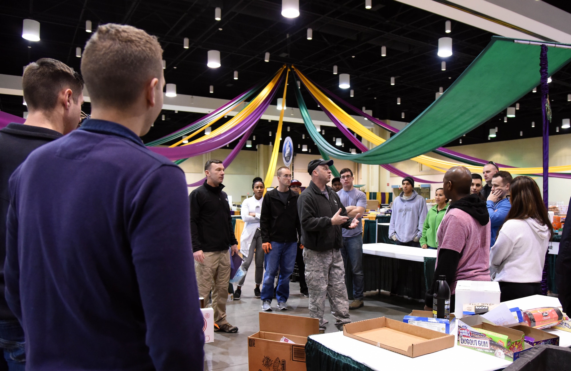 Col. Danny Davis, 81st Mission Support Group commander, thanks Keesler personnel for volunteering during a food drive at the Mississippi Coast Coliseum and Convention Center Jan. 16, 2018, Biloxi, Mississippi. More than 80 Airmen participated in the wing-level community sponsored volunteer event packaging over 21,000 pounds of food, equating to approximately 17,500 meals that will be provided to hunger relief. (U.S. Air Force photo by Kemberly Groue)