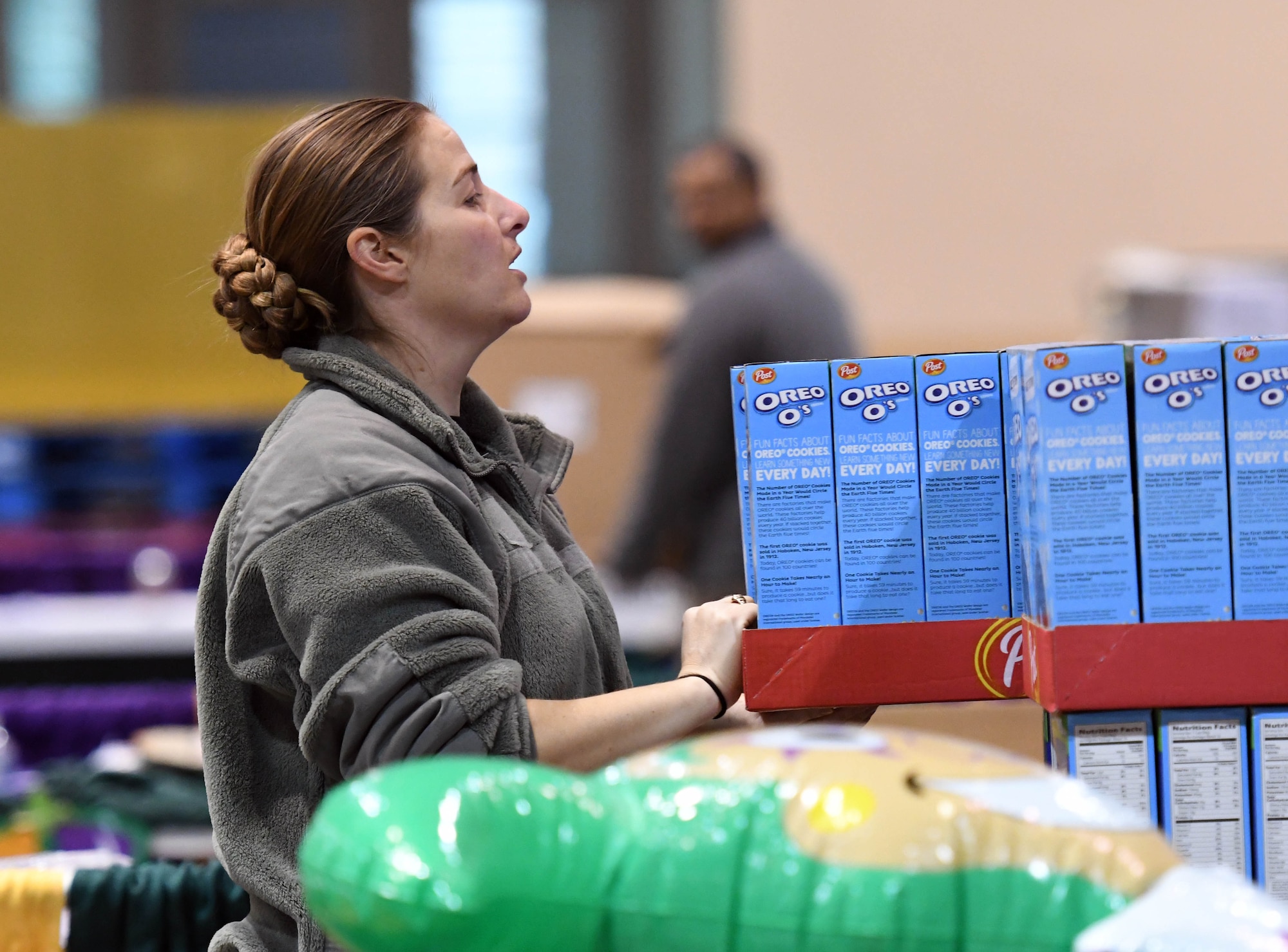 Tech. Sgt. Jennifer Watts, 81st Training Wing command chief executive assistant, packages food items during a food drive at the Mississippi Coast Coliseum and Convention Center Jan. 16, 2018, Biloxi, Mississippi. More than 80 Airmen participated in the wing-level community sponsored volunteer event packaging over 21,000 pounds of food, equating to approximately 17,500 meals that will be provided to hunger relief. (U.S. Air Force photo by Kemberly Groue)