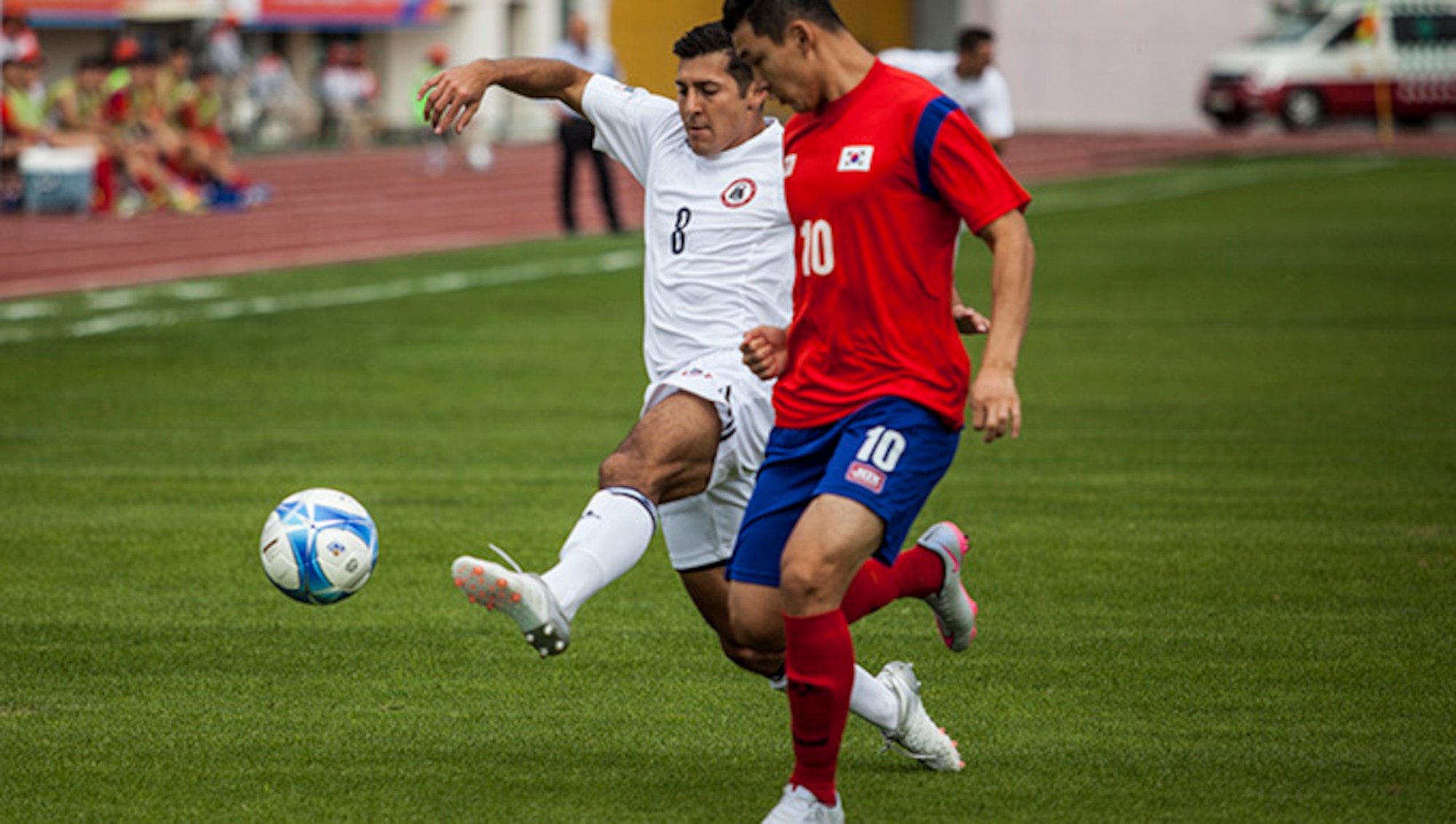 MUNGYEONG, South Korea, (Sept. 30, 2015)— Aaron Zendejas of the U.S. Mens Soccer Team fights for the ball at the first soccer match of the 2015 6th CISM World Games. The CISM World Games provides the opportunity for the athletes of over 100 different Nations to come together and enjoy friendship through sports. The sixth annual CISM World Games are being held aboard Mungyeong, South Korea, Sept. 30-Oct. 11.
