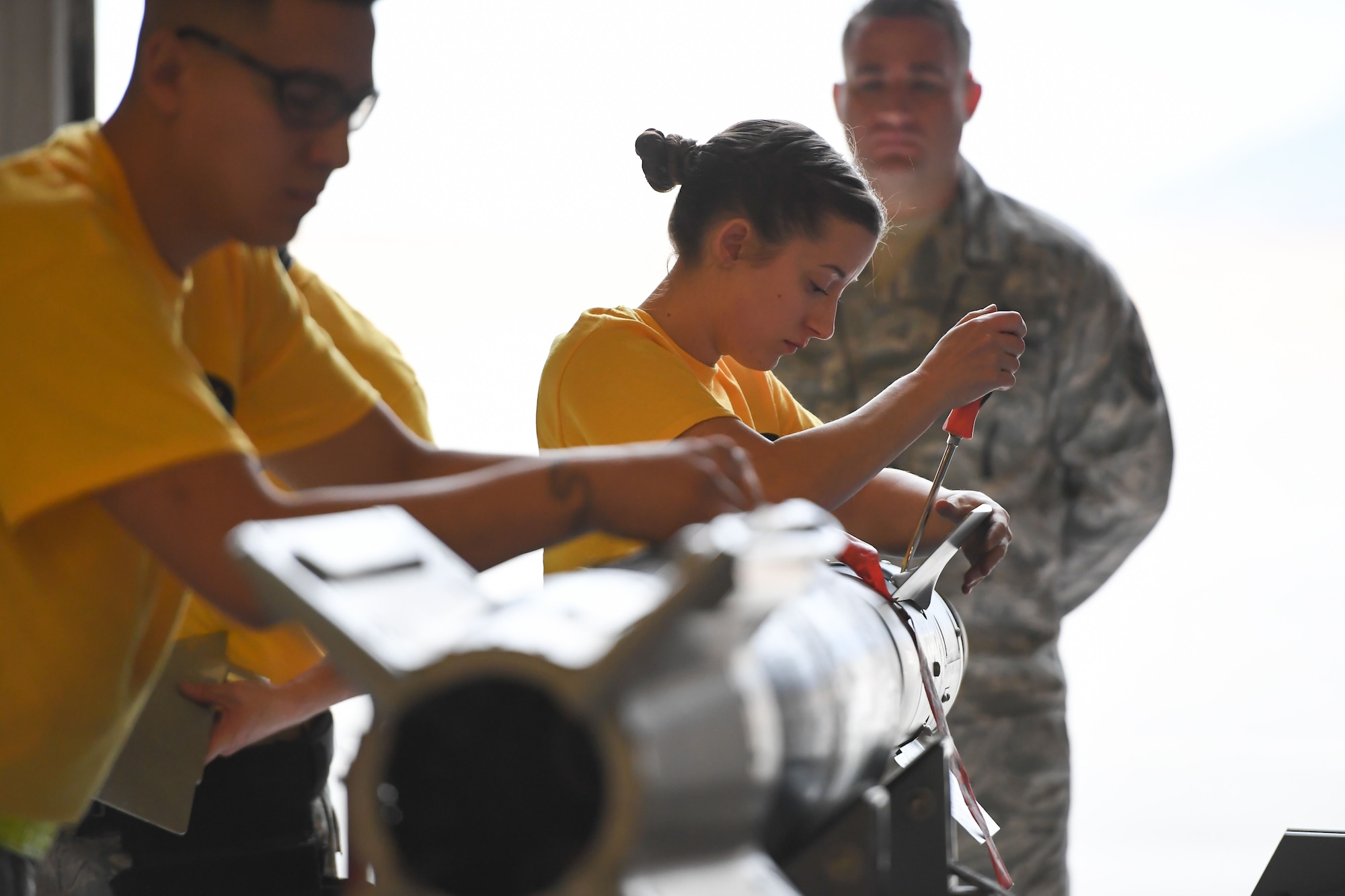 Staff Sgt. Kayla Bruns from the 4th Aircraft Maintenance Unit in the 388th Fighter Wing preps a GBU-12 laser guided bomb during the F-35A weapons loading competition Jan. 19, 2018, at Hill Air Force Base, Utah. These competitions benefit Airmen by honing their specialty skills and bolsters comradery and friendly rivalries. (U.S. Air Force photo by Cynthia Griggs)