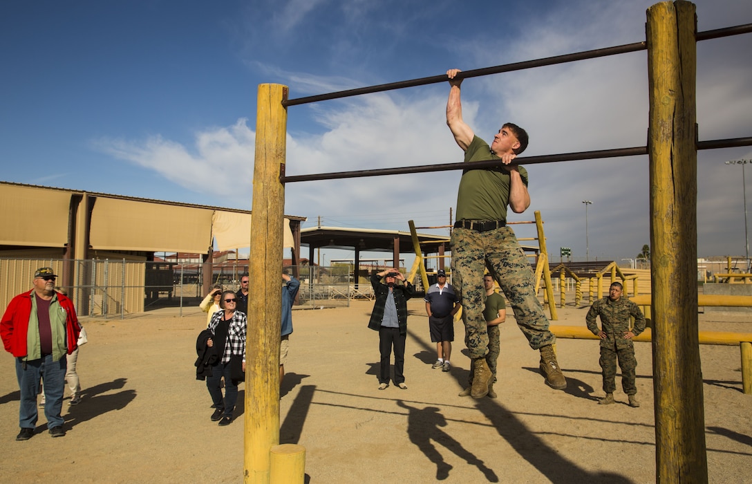 Guests participating in the first Marine Corps Air Station (MCAS) Yuma Winter Tour of the year observe the capabilities of the station, a demonstration of the K-9 unit, and an obstacle course demonstration at various locations on MCAS Yuma, Ariz., Jan. 16, 2017.  The tours have not been conducted for the past two years, but have been resumed by Col. David A. Suggs, the station commanding officer, to build a better relationship with the community. (U.S. Marine Corps photo taken by Cpl. Isaac Martinez)
