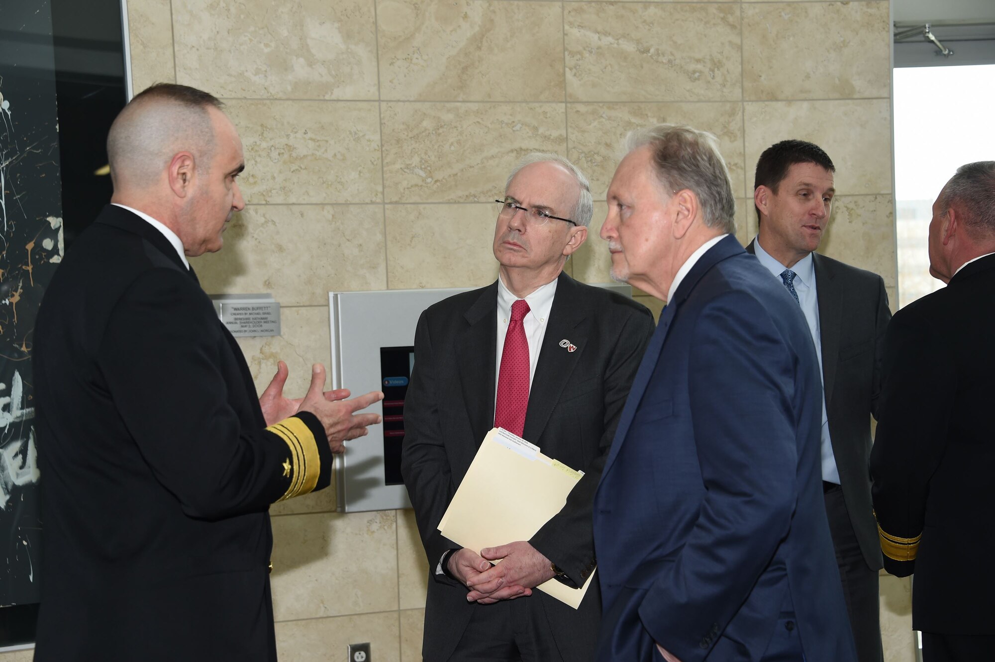 U.S. Navy Vice Adm. Charles Richard (left), deputy commander of U.S. Strategic Command (USSTRATCOM), speaks to Dr. Jeffrey Gold (center), University of Nebraska at Omaha (UNO) chancellor, and Dr. Lou Pol, dean of UNO’s College of Business, during the USSTRATCOM Leadership Fellows Program kickoff at the UNO’s Mammel Hall, Jan. 18, 2018.