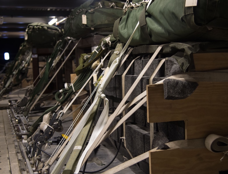 Heavy cargo pallets, weighing as much as 3,400 pounds, are packet with rubber lumber at the 773d Logistics Readiness Squadron combat mobility flight at Joint Base Elmendorf-Richardson, Alaska, Jan. 18, 2018. When called upon, PACAF’s C-130 Hercules and C-17 Globemaster III aircraft airdrop the pallets, delivering critical supplies to warfighters down range as well as provide support for rescue missions in Alaska.