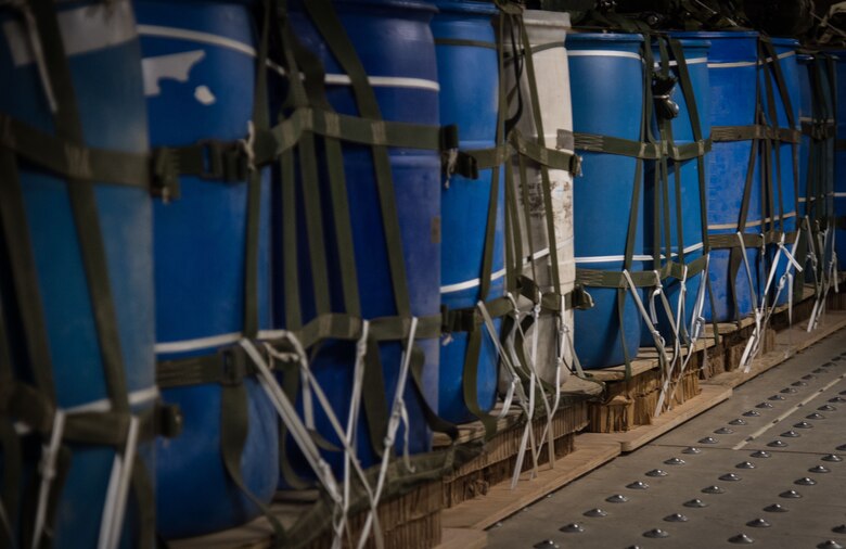 Heavy cargo pallets are packed with four 600-pound water barrels at the 773d Logistics Readiness Squadron combat mobility flight at Joint Base Elmendorf-Richardson, Alaska, Jan. 18, 2018. When called upon, PACAF’s C-130 Hercules and C-17 Globemaster III aircraft airdrop the pallets, delivering critical supplies to warfighters down range as well as provide support for rescue missions in Alaska.
