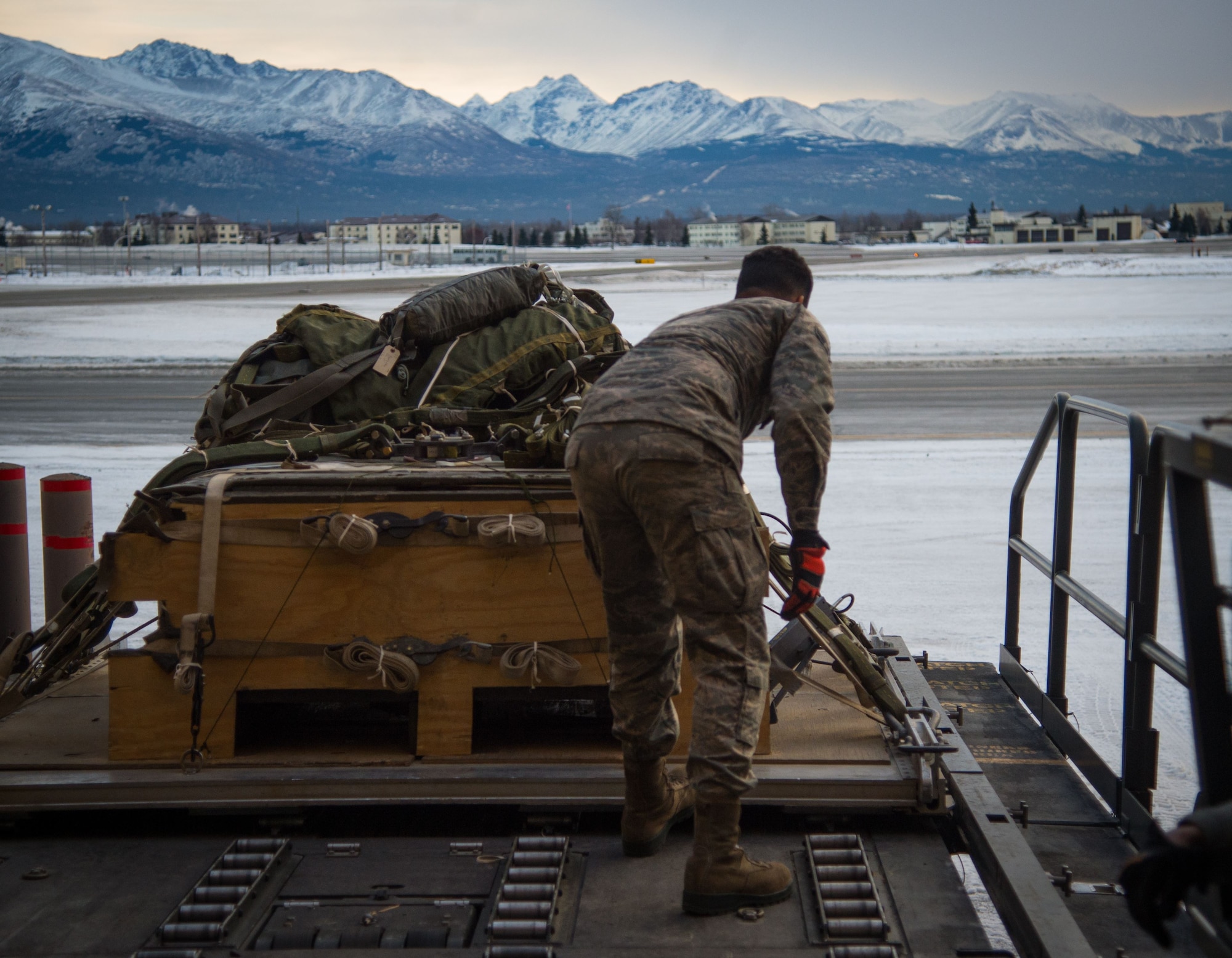 U.S. Air Force Senior Airman Roger Blumhorst, 773d Logistics Readiness Squadron combat mobility technician, loads a heavy cargo pallet onto a Halvorsen Loader at Joint Base Elmendorf-Richardson, Alaska, Jan. 18, 2018. The Halvorsen Loader is a rapidly deployable, high-reach mechanized aircraft loader that can transport and lift up to 25,000 pounds of cargo and load it onto military and civilian aircraft. JBER’s combat mobility flight is the largest in PACAF, providing C-130 Hercules and C-17 Globemaster III unilateral airdrop and airland training for two wings and three squadrons while at home station, as well as all of the airdrop training to Red Flag Alaska.