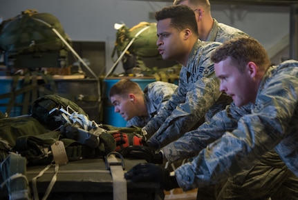 U.S. Air Force Airmen assigned to the 773d Logistics Readiness Squadron combat mobility flight push a 3,400-pound cargo pallet onto a Halvorsen Loader at Joint Base Elmendorf-Richardson, Alaska, Jan. 18, 2018. The Halvorsen Loader is a rapidly deployable, high-reach mechanized aircraft loader that can transport and lift up to 25,000 pounds of cargo and load it onto military and civilian aircraft. JBER’s combat mobility flight is the largest in PACAF, providing C-130 Hercules and C-17 Globemaster III unilateral airdrop and airland training for two wings and three squadrons while at home station, as well as all of the airdrop training to Red Flag Alaska.