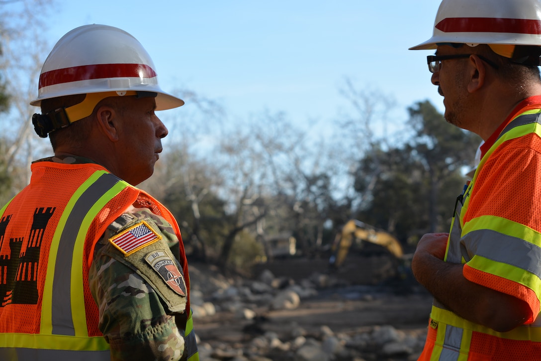 U.S. Army Corps of Engineers Commanding General Lt. Gen. Todd Semonite speaks with Los Angeles District Project Engineer Robert Ramos about debris removal activities at a detention basin in Montecito, California, Jan. 18. The Corps, as assigned by the Federal Emergency Management Agency, is removing more than 450,000 cubic yards of debris from 11 basins and 10 channels in areas of Santa Barbara, California, hit hard by the disaster that left 18 people dead.