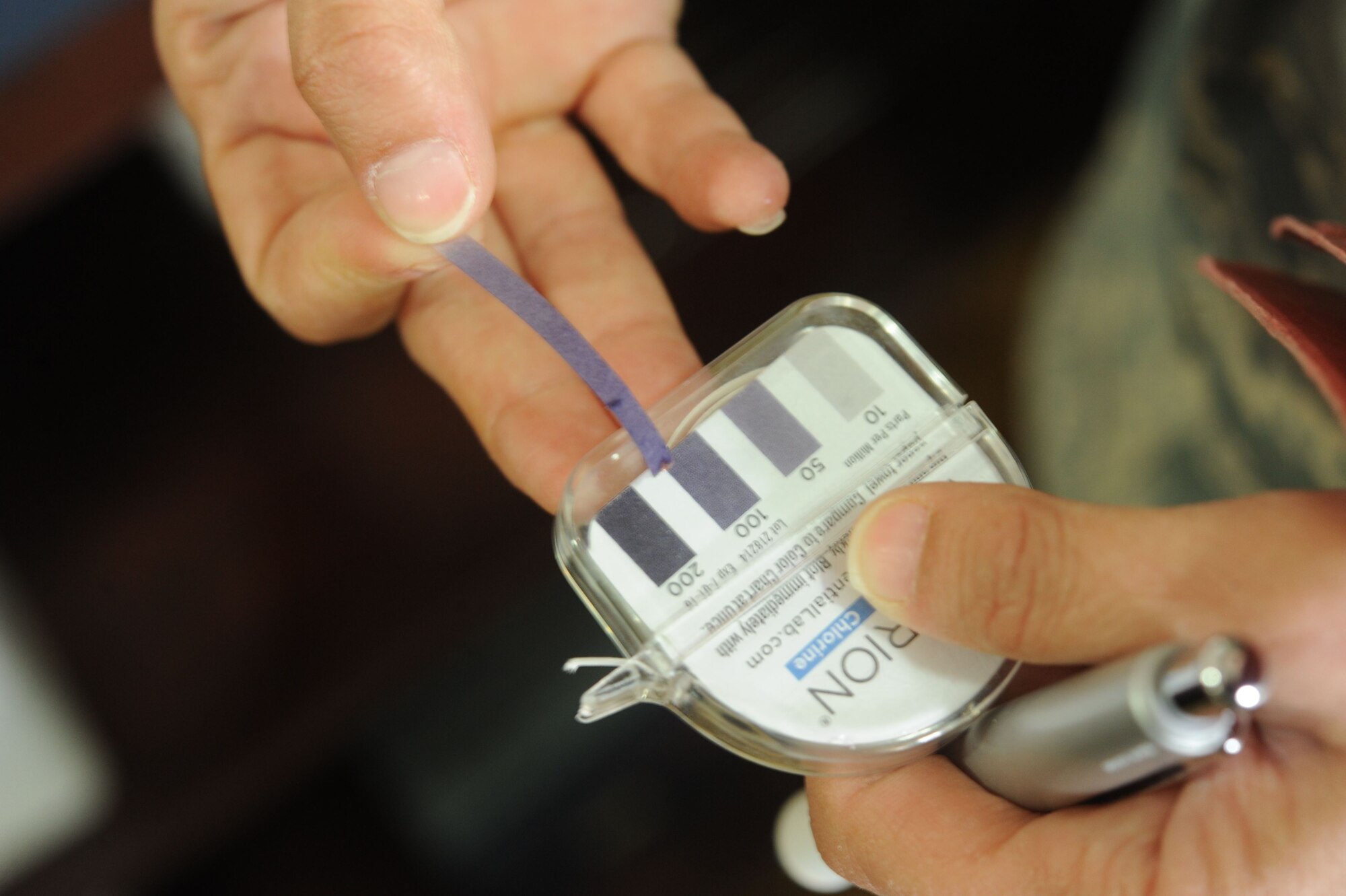U. S. Air Force Tech. Sgt. Brandi Perryman, 380th Expeditionary Medical Group noncommissioned officer in charge of public health, performs a sanitation water inspection during a facility inspection Jan. 18, 2018, Al Dhafra Air Base, United Arab Emirates. The public health office on ADAB inspects all phases of food handling operations. (U. S. Air Force photo by Airman 1st Class D. Blake Browning)