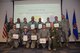 Col. Thomas K. Smith Jr.(bottom row, right), 433rd Airlift Wing commander, congratulated the 433rd Airlift Wing Senior NCO and NCO inductees during a ceremony , sponsored by The Alamo Wing Top 3 Association, Chief's Group, First Sergeants Council and Alamo Rising 6, at the Robert D. Gaylor NCO Academy here 20 Jan 2018.  Smith encouraged the newly inducted Airmen to continue professionally progressing. (U.S. Air Force photo by Tech Sgt. Carlos J. Treviño)