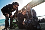 Explosive Ordnance Disposal Technician assigned to Commander, Task Group 56.1, explains underwater navigation system to Kuwait naval force technicians during training evolution as part of exercise Eager Response 18, Mohammed Al-Ahmad Naval Base, Kuwait, January 8, 2018 (U.S. Navy/Louis Rojas)