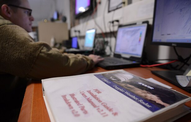 Staff Sgt. Tim Everhard, 451st Expeditionary Operation Support Squadron weather forecaster craftsman, looks at a weather doppler radar Jan. 11, 2018 at Kandahar Airfield, Afghanistan.