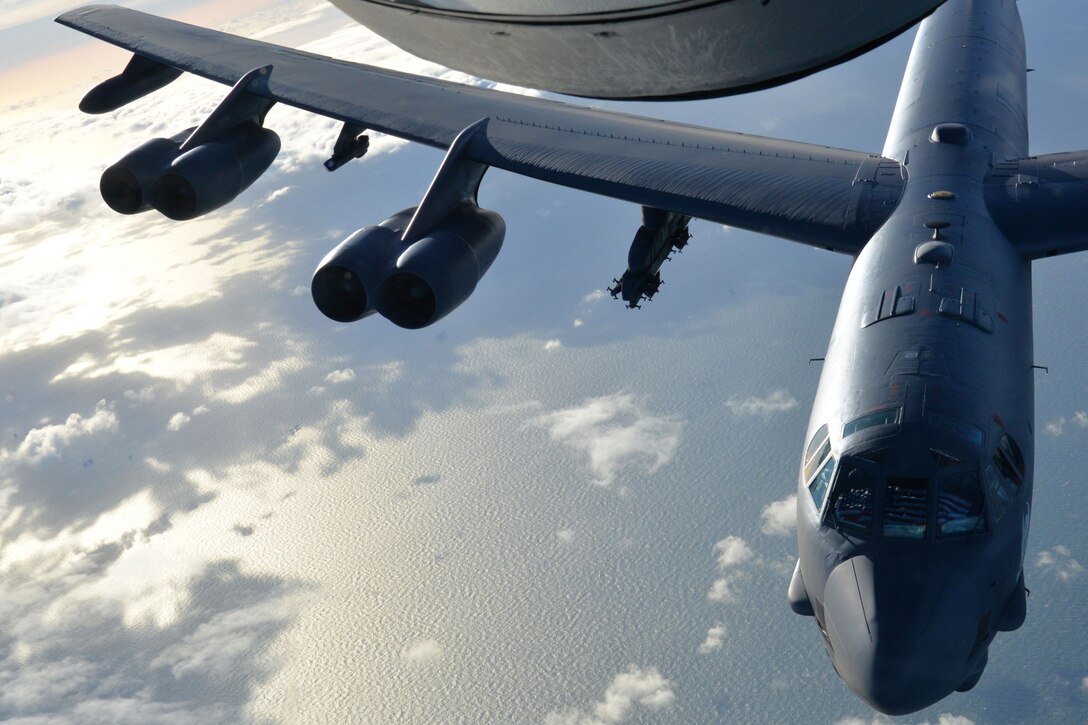 A U.S. Air Force B-52 Stratofortress deployed from Minot Air Force Base, N.D., flies behind a KC-135 Stratotanker assigned to the 100th Air Refueling Wing at RAF Mildenhall, England, over the North Sea, Jan. 19, 2018.