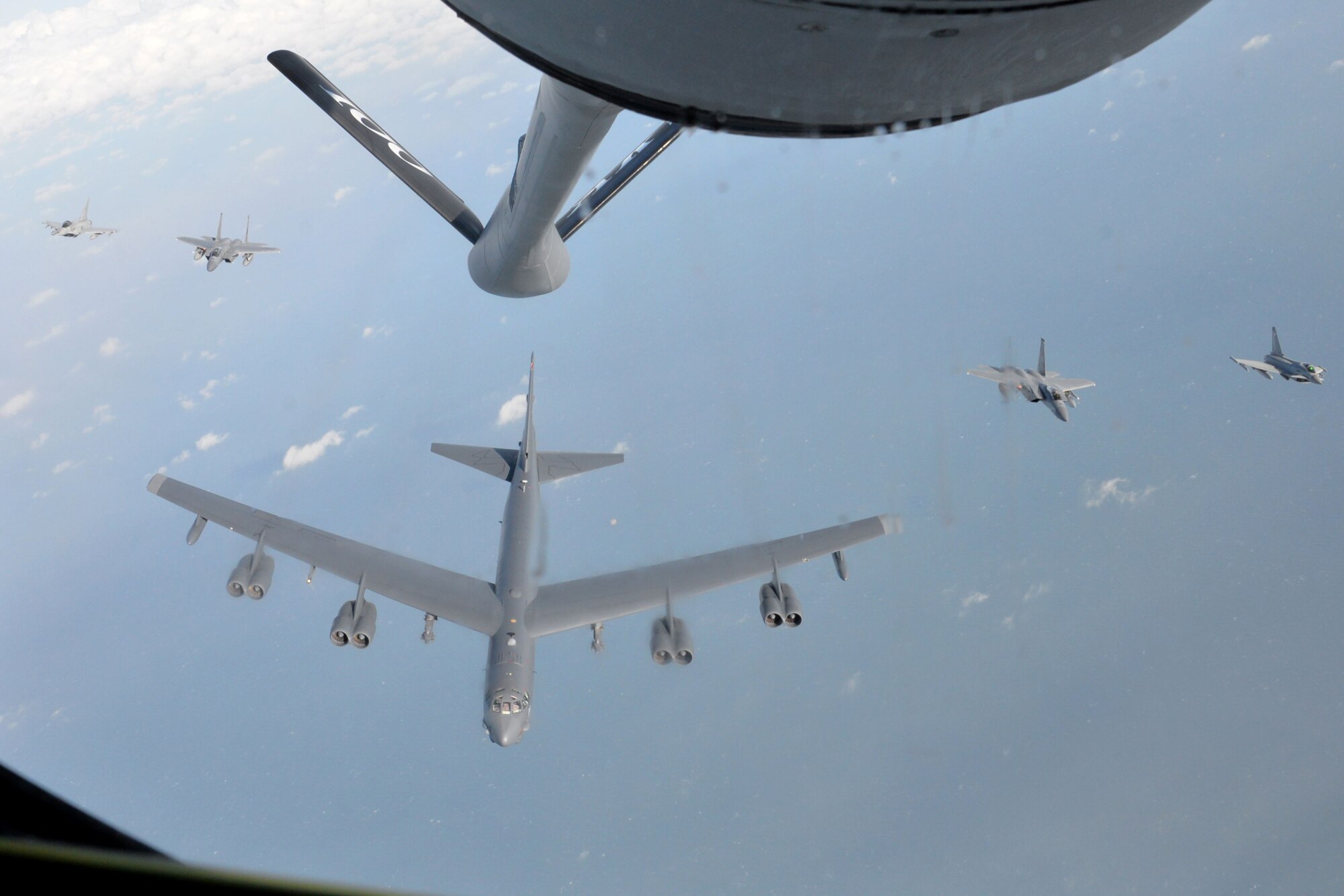 A formation consisting of a two Royal Air Force Typhoons, two U.S. Air Force F-15C Eagles assigned to RAF Lakenheath and a U.S. Air Force B-52 Stratofortress flies over the North Sea off the coast of England, Jan. 19, 2018.