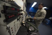 U.S. Air Force Staff Sgt. Shaun Kileleman, 44th Fighter Squadron aircrew flight equipment assistant NCO in charge, uses a combined aircrew system tester to check an anti-gravity suit Jan. 18, 2018, at Kadena Air Base, Japan. The anti-gravity suit enables pilots to endure accelerated forces by keeping blood flow from their lower extremities while experiencing large amounts of gravitational force. (U.S. Air Force photo by Staff Sgt. Micaiah Anthony)