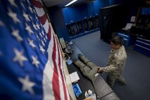 U.S. Air Force Staff Sgt. Shaun Kileleman, 44th Fighter Squadron aircrew flight equipment assistant NCO in charge, prepares to inspect an anti-gravity suit Jan. 18, 2018, at Kadena Air Base, Japan. The anti-gravity suit enables pilots to endure accelerated forces by keeping blood flow from their lower extremities while experiencing large amounts of gravitational force during flight. (U.S. Air Force photo by Staff Sgt. Micaiah Anthony)