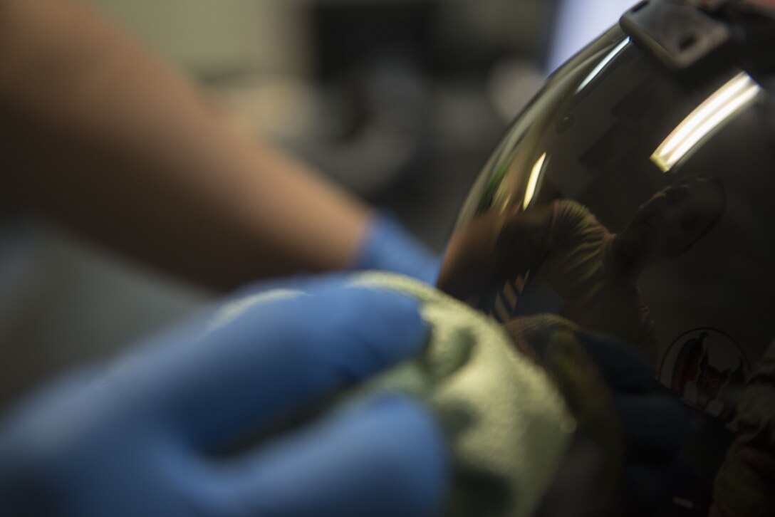 U.S. Air Force Airman 1st Class Denise McCarthy, 44th Fighter Squadron aircrew flight equipment apprentice, cleans a helmet Jan. 18, 2018, at Kadena Air Base, Japan. Equipment must be tested, inspected and cleaned regularly to ensure proper functionality. (U.S. Air Force photo by Staff Sgt. Micaiah Anthony)