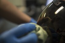 U.S. Air Force Airman 1st Class Denise McCarthy, 44th Fighter Squadron aircrew flight equipment apprentice, cleans a helmet Jan. 18, 2018, at Kadena Air Base, Japan. Equipment must be tested, inspected and cleaned regularly to ensure proper functionality. (U.S. Air Force photo by Staff Sgt. Micaiah Anthony)
