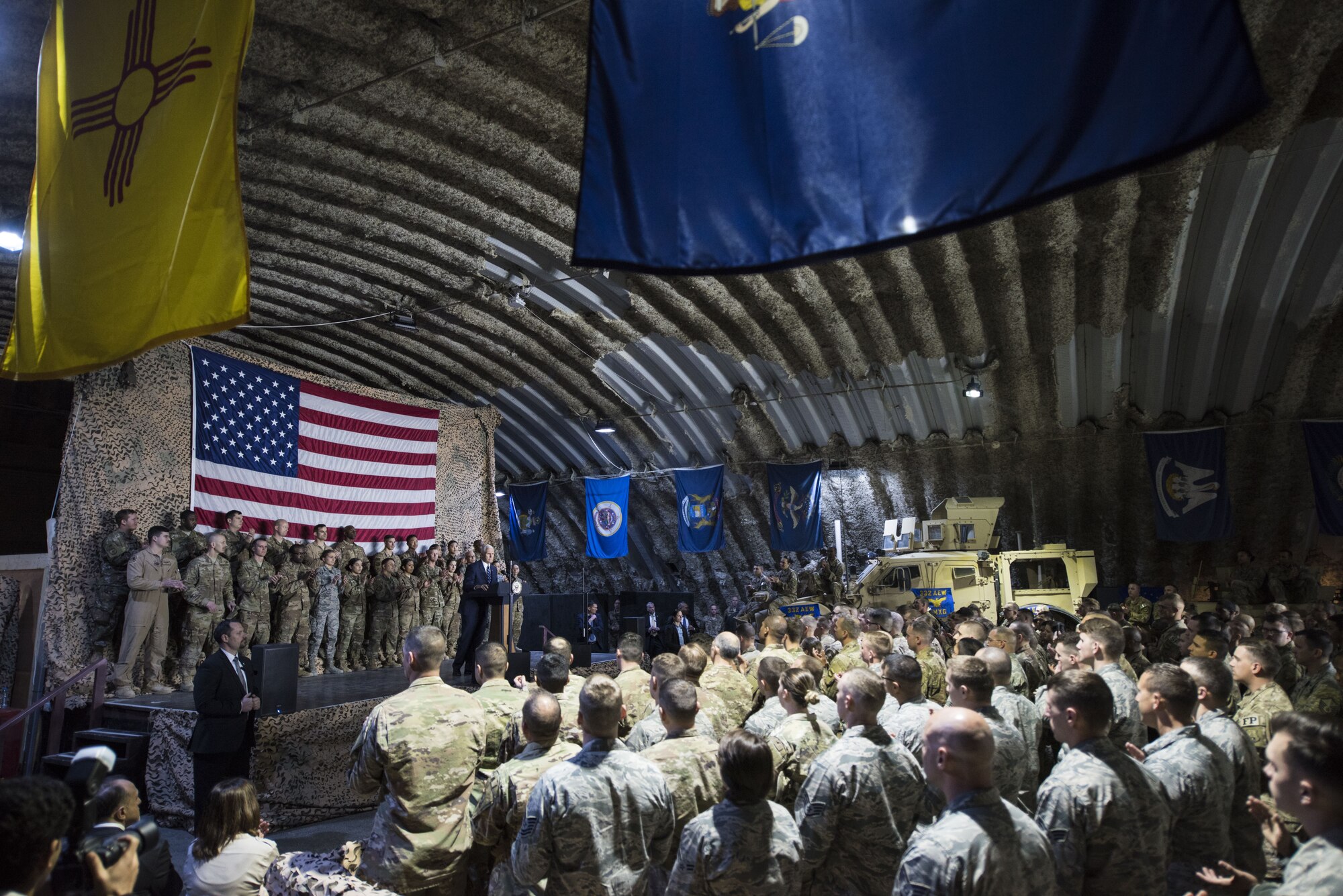 U.S. Vice President Mike Pence speaks to a crowd of deployed service members assigned to the 332d Air Expeditionary Wing January 21, 2018 at an undisclosed location in Southwest Asia. During his speech, Pence praised the wing’s continued dedication to the production of unrivaled airpower and reaffirmed the administration’s efforts to end the current government shutdown. (U.S. Air Force photo by Staff Sgt. Joshua Kleinholz)