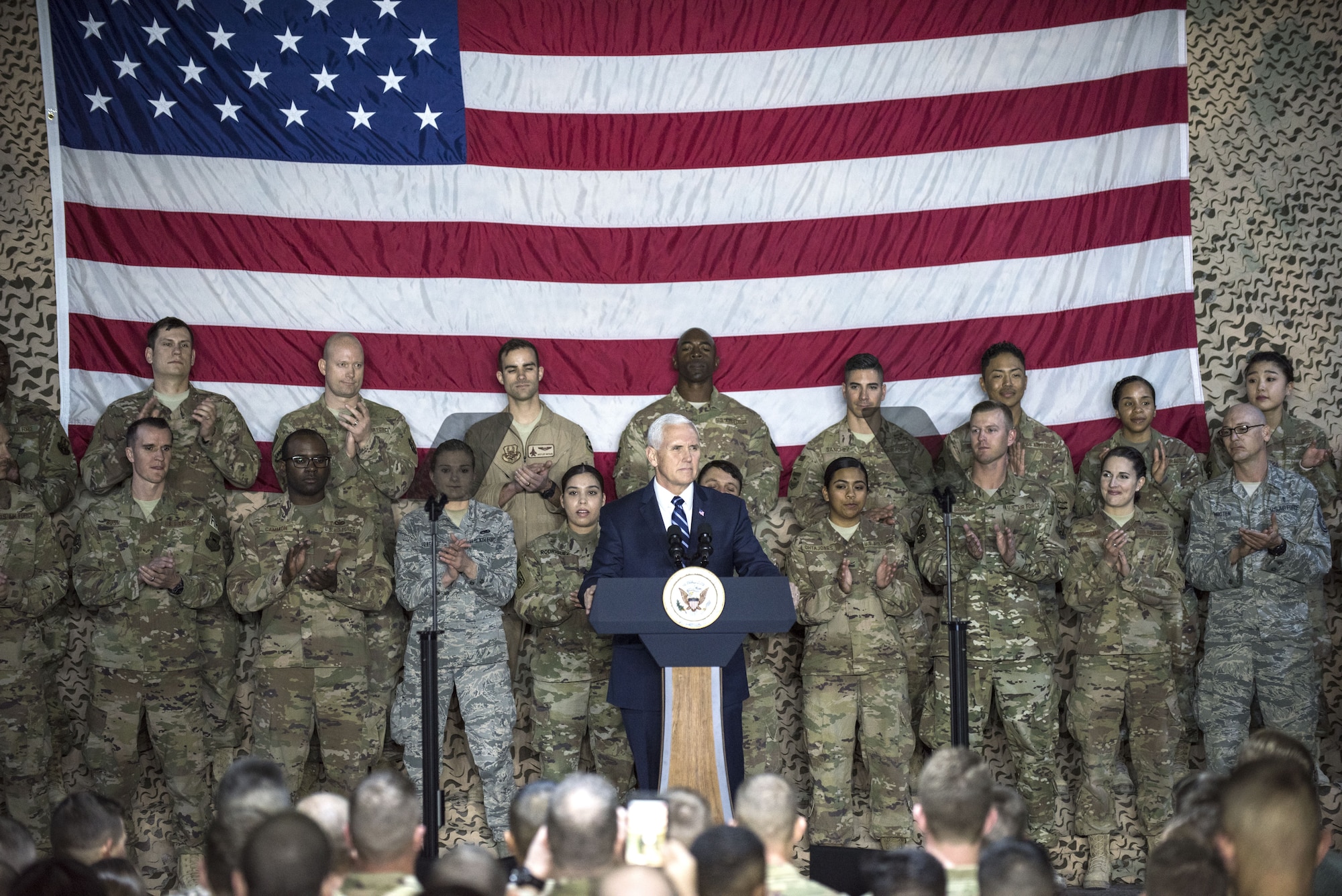 U.S. Vice President Mike Pence speaks to a crowd of deployed service members assigned to the 332d Air Expeditionary Wing January 21, 2018 at an undisclosed location in Southwest Asia. Pence’s visit came as part of an extended trip across the Middle East, during which he reaffirmed the U.S. military’s commitment to defeating dangerous radicalism throughout the region.  (U.S. Air Force photo by Staff Sgt. Joshua Kleinholz)