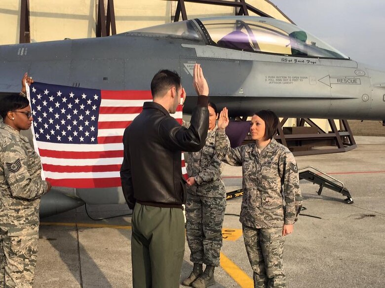 MSgt Ashley Strong (right), a U.S. Air Force dental flight chief, re-enlisted at Aviano Air Force Base, Italy on Feb 19th, 2016. It was here where she worked with her team, highlighting their strengths and learning from the experiences of her fellow Airmen to better provide quality patient care. (Courtesy photo)