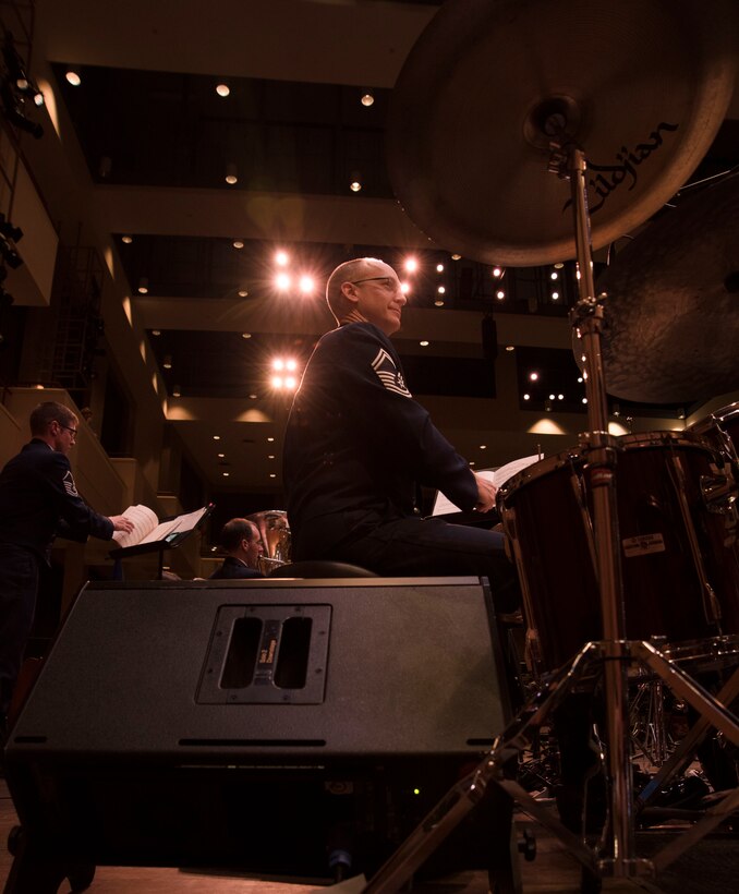 Senior Master Sgt. Reynolds plays the drum kit.