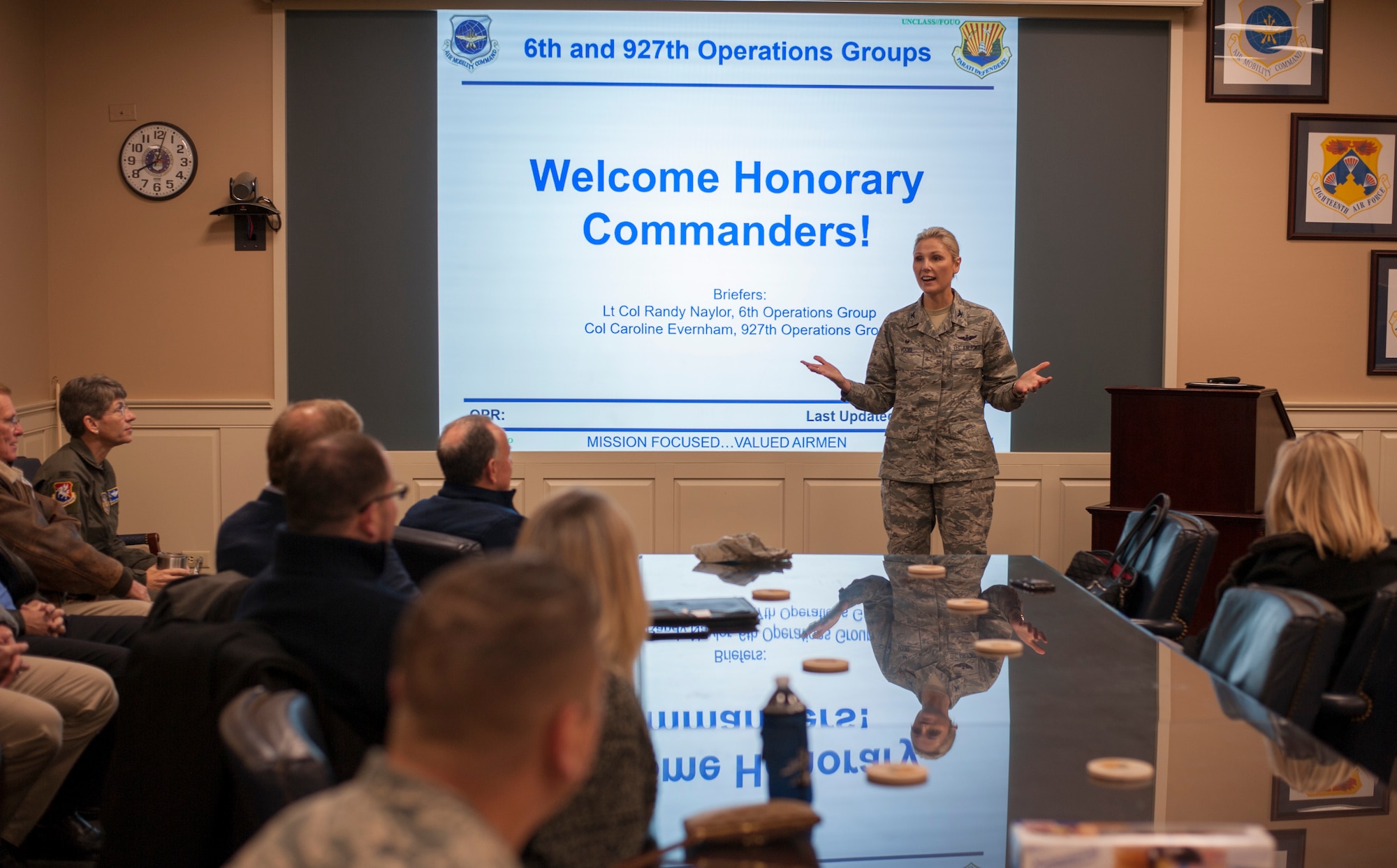 U.S. Air Force Col. April Vogel, the commander of the 6th Air Mobility Wing, welcomes a group of honorary commanders during an immersion tour at MacDill Air Force Base, Fla., Jan. 18, 2018.