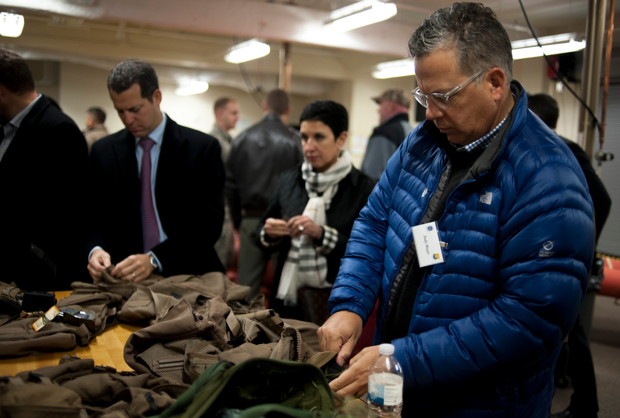 Honorary commanders take a glance at various aircrew flight equipment during an immersion tour at MacDill Air Force Base, Fla., Jan. 18, 2018.