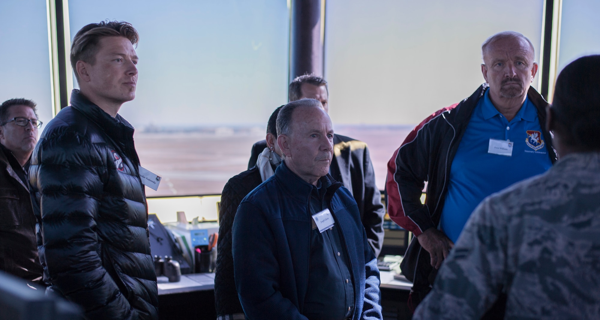Honorary commanders receive a mission brief in the air traffic control tower during an immersion tour at MacDill Air Force Base, Fla., Jan. 18, 2018.