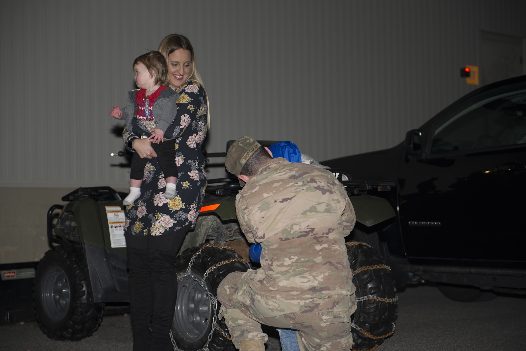 Staff Sgt. Issac McCauley, 436th Security Forces Squadron defender, returns home from a deployment Jan. 21, 2018, at Dover Air Force Base, Del. He was met by his family for the first time in six months after his deployment to the Middle East. (U.S. Air Force photo by Airman 1st Class Zoe M. Wockenfuss)