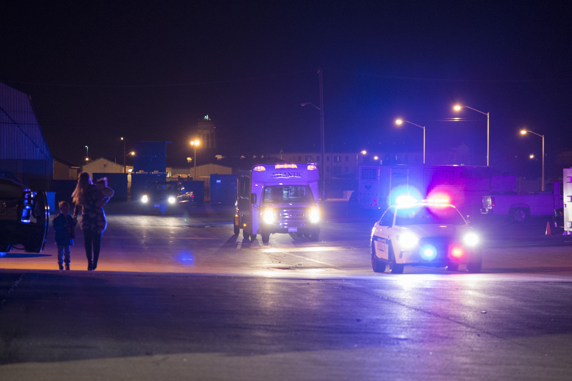 A 436th Security Forces Squadron patrol car escorts defenders on their return home from deployment Jan. 21, 2018, at Dover Air Force Base, Del. The Airmen were deployed to the Middle East for six months. (U.S. Air Force Photo by Staff Sgt. Aaron J. Jenne)