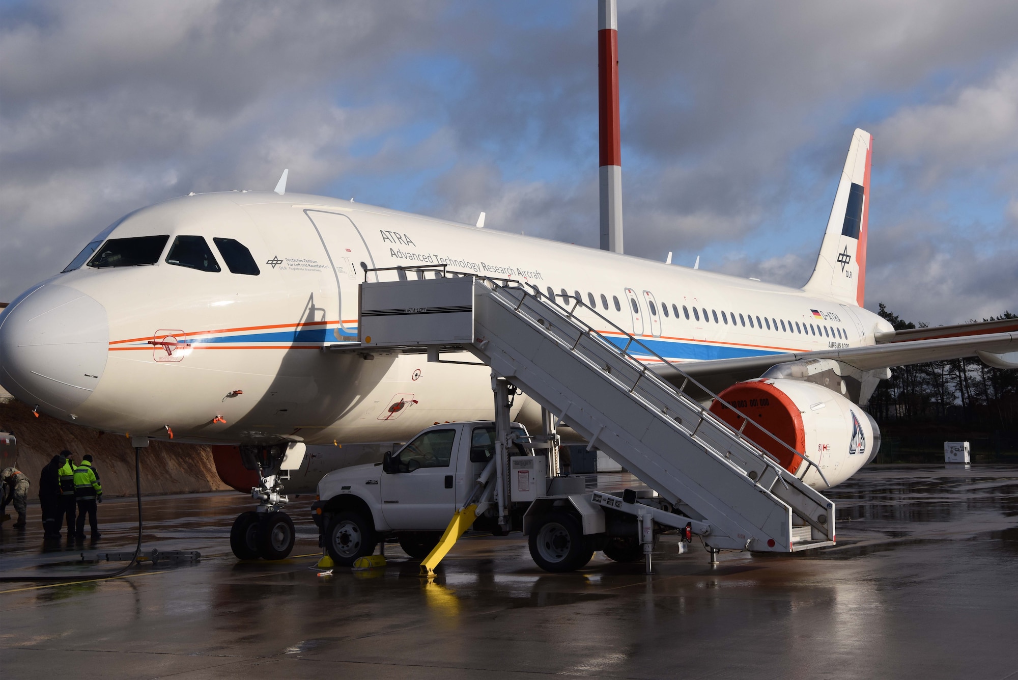 Maintainers from The German Aerospace Center prepare the Advanced Technology Research Aircraft Airbus A320 (D-ATRA), on Ramstein Air Base, Germany for a day of bio-fuel testing. The A320 is the latest and largest addition to the DLR’s research fleet.