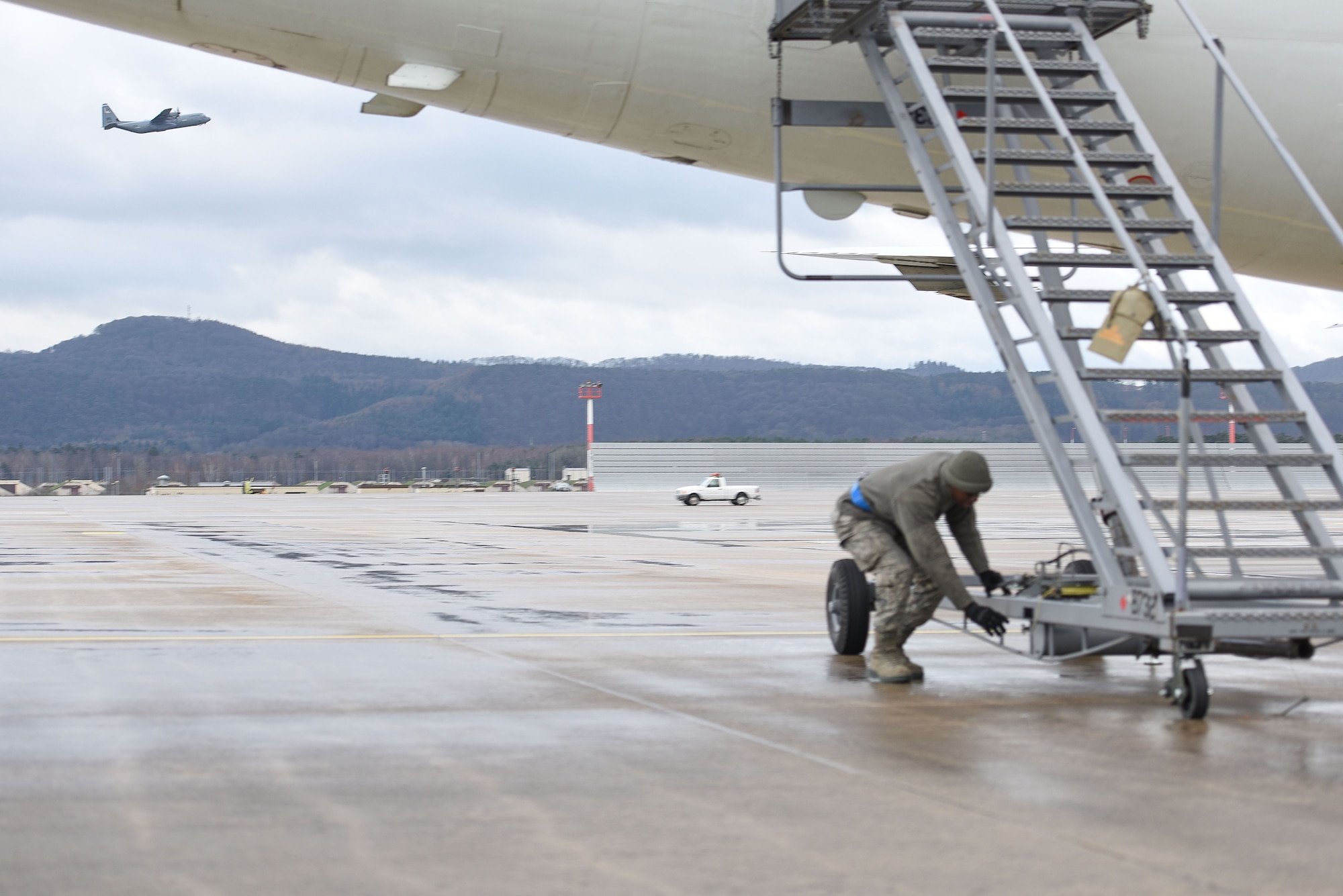 Senior Airman Christian Sharpe, 721st Air Maintenance Squadron crew chief, secures a mobile staircase to the United States National Aeronautics and Space Administration Armstrong Flight Research Center aircraft on Jan. 18, 2017 at Ramstein Air Base. According to NASA, continued investment and support will create future U.S. aircraft that consume only half as much fuel and generate only one quarter of current emissions compared to aircraft flown today.