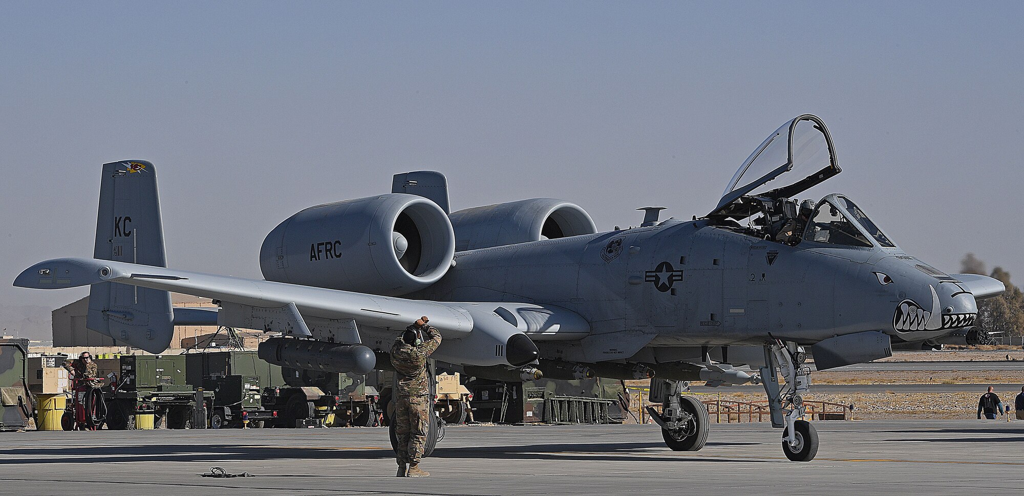 An A-10 Thunderbolt II crew chief, assigned to Whiteman Air Force Base, prepares to launch an aircraft on Kandahar Airfield, Afghanistan, Jan. 20, 2018.