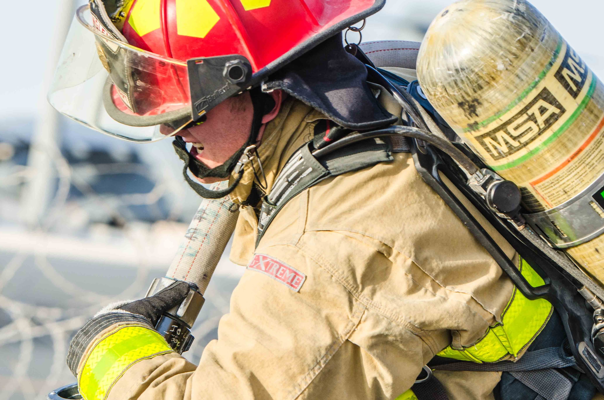 Airman participate in a firefighter combat challenge