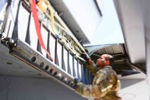 Crew chief inspects KC-135 for wear and tear