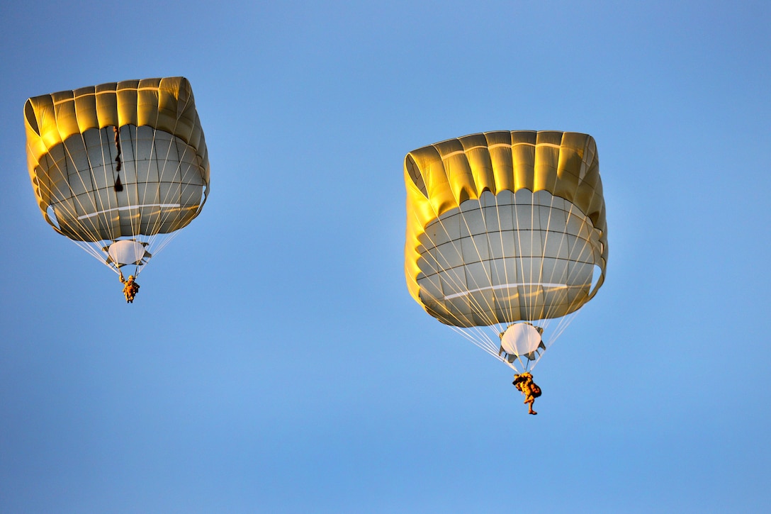 Soldiers descend over Juliet Drop Zone during airborne operations in Pordenone, Italy.