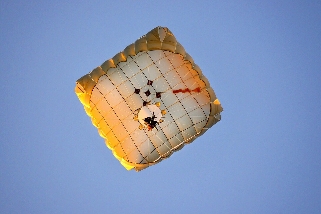 A soldier descends onto Juliet Drop Zone during airborne operations.