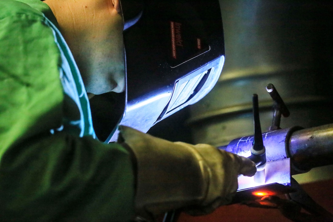 Rhode Island Army National Guard Sgt. Anthony Iapicca performs gas tungsten arc welding on stainless steel.