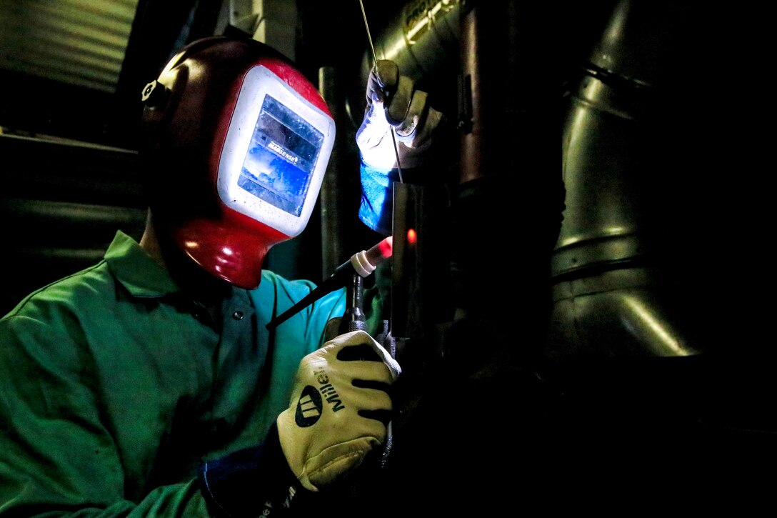 North Carolina Army National Guard Sgt. Michael Gray performs gas tungsten arc welding on stainless steel.