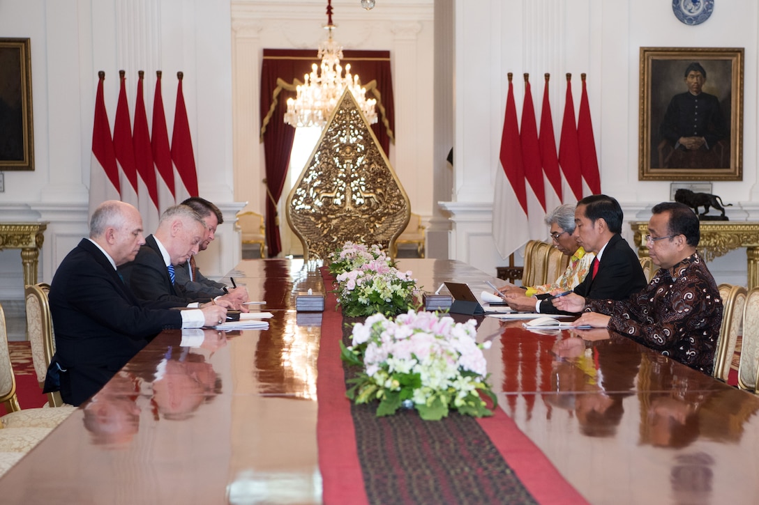 Defense Secretary James N. Mattis sits across the table form the Indonesian president.