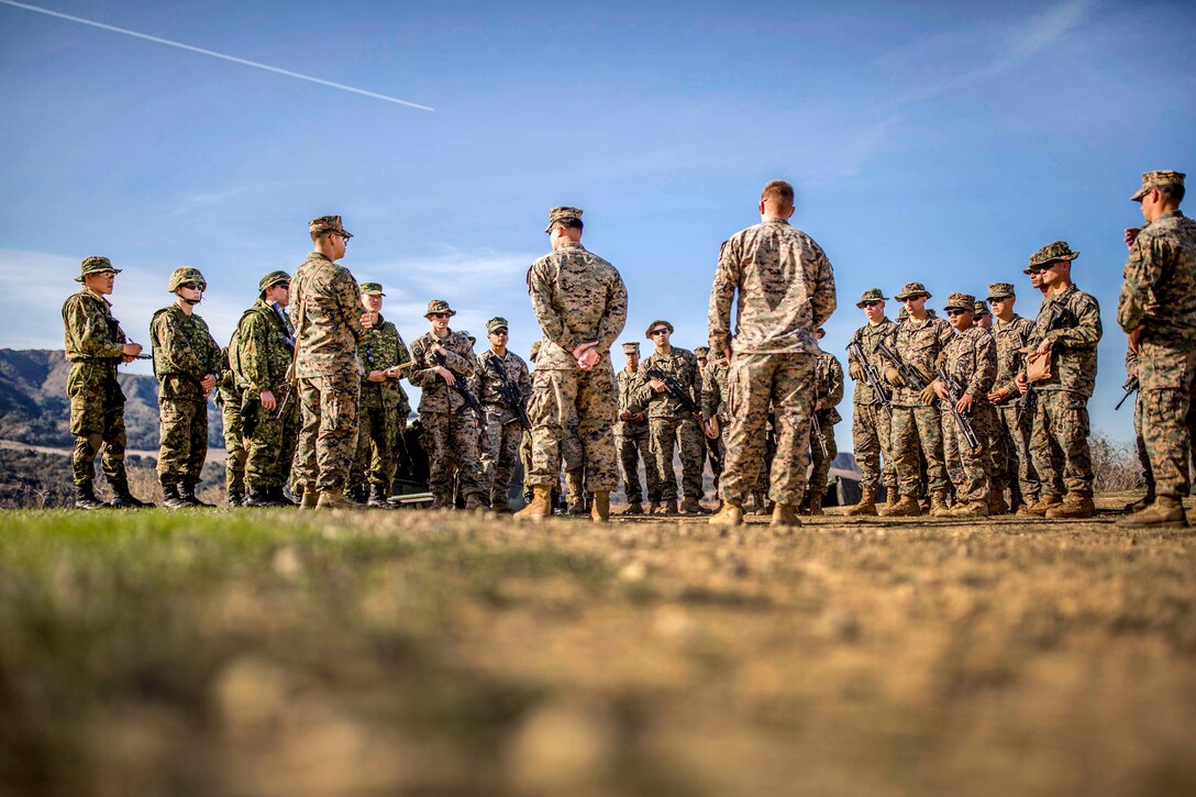 U.S. Marines and Japan Ground Self Defense Force troops receive a safety brief.