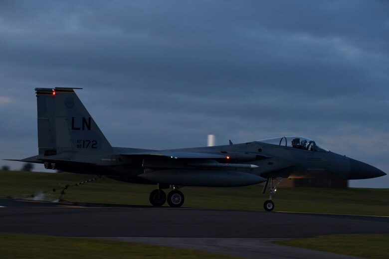 An F-15C Eagle assigned to the 493rd Fighter Squadron catches an aircraft arresting system during a certification Jan. 22, 2018 at Royal Air Force Lakenheath, England. The aircraft arresting systems are designed to bring aircraft to a safe stop during emergency situations. (U.S. Air Force photo/Airman 1st Class Eli Chevalier)