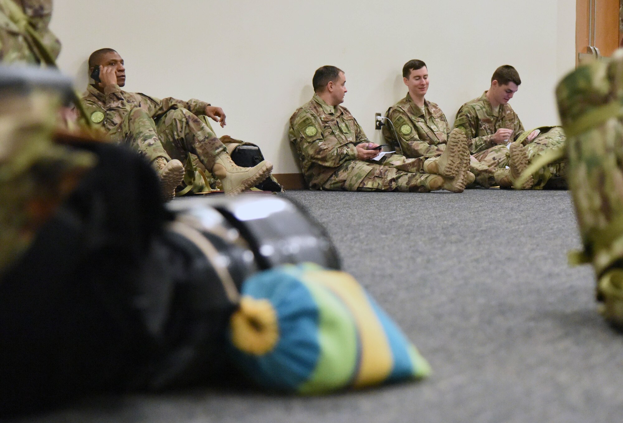 Keesler personnel rest while in-processing for deployment at the Roberts Consolidated Aircraft Maintenance Facility Jan. 8, 2018, on Keesler Air Force Base, Mississippi. Members of the 403rd Wing make preparations for an upcoming deployment to an undisclosed location. (U.S. Air Force photo by Kemberly Groue)