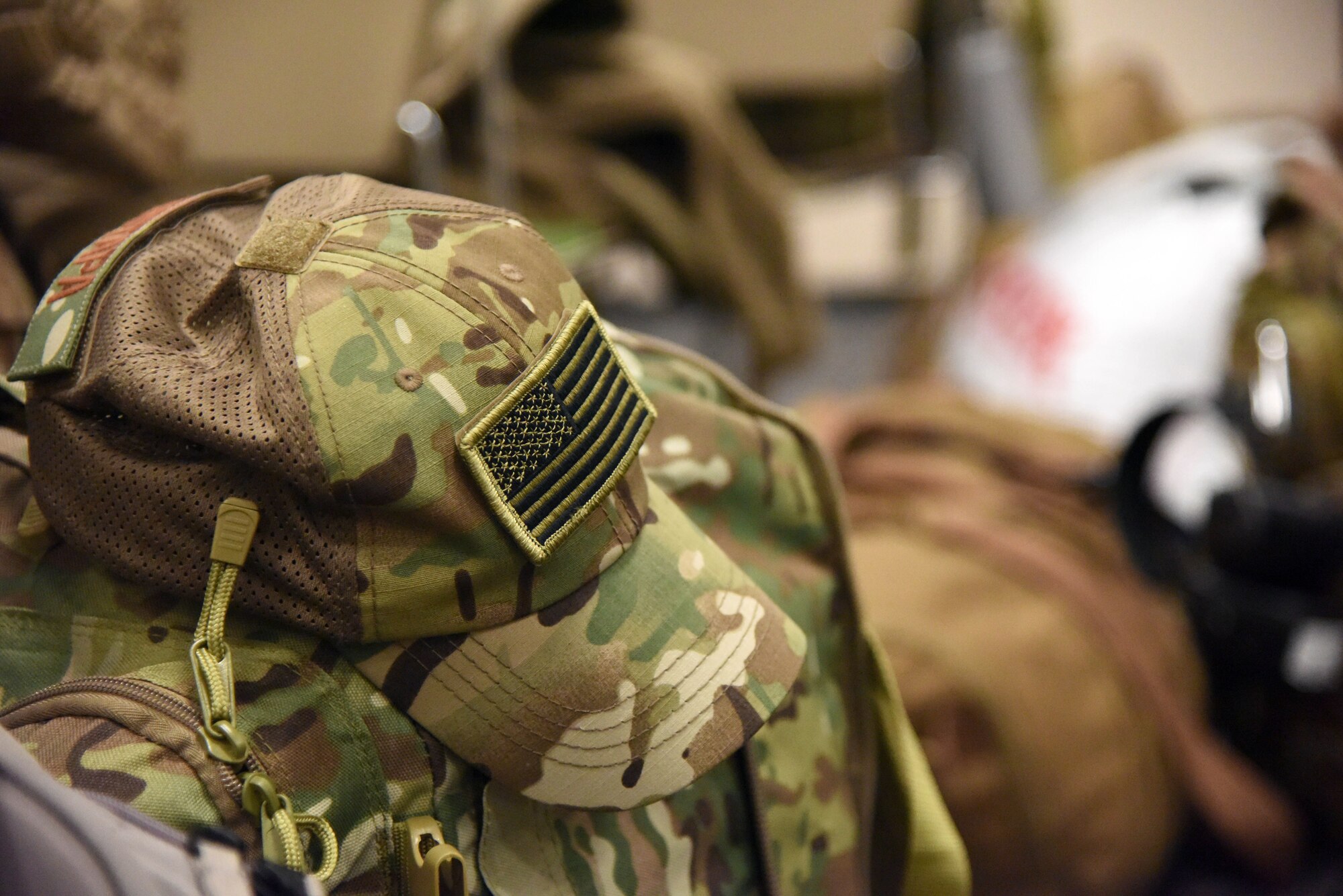 An Air Force deployment hat rests on luggage as Keesler personnel in process for deployment at the Roberts Consolidated Aircraft Maintenance Facility Jan. 8, 2018, on Keesler Air Force Base, Mississippi. Members of the 403rd Wing make preparations for an upcoming deployment to an undisclosed location. (U.S. Air Force photo by Kemberly Groue)