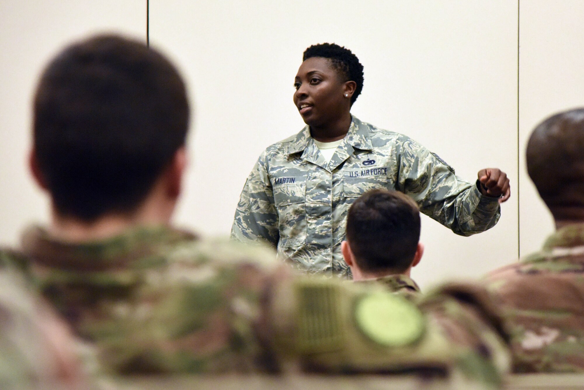 Tech. Sgt. Sabrina Martin, 81st Logistics Readiness Squadron personal property passenger travel NCO in charge, briefs on anti- hijacking safety procedures to Keesler personnel as they in process for deployment at the Roberts Consolidated Aircraft Maintenance Facility Jan. 8, 2018, on Keesler Air Force Base, Mississippi. Members of the 403rd Wing make preparations for an upcoming deployment to an undisclosed location. (U.S. Air Force photo by Kemberly Groue)