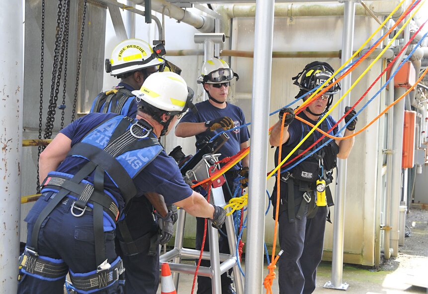 Members of the Arnold Fire and Emergency Services rig a 260-foot lift using a power winch during an exercise at the J-4 Rocket Motor Test Facility at Arnold Air Force Base. The winch allows firefighters to raise or lower a victim quickly and safely. (U.S. Air Force photo/Jacqueline Cowan)